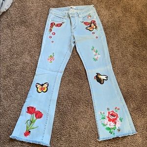 Jeans with embroidery flowers.